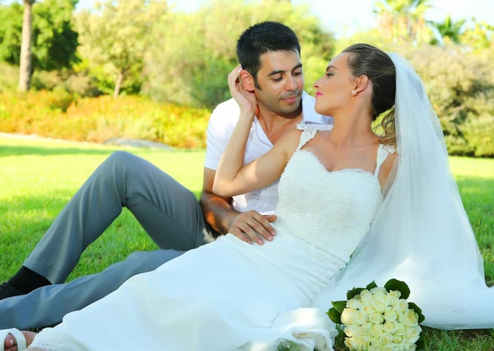 Couple embrace outdoor shoot at golden hour
